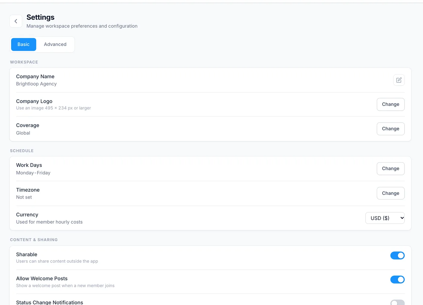 The Basic tab of workspace settings: company name, logo and coverage, then work days, time zone and currency, then sharing switches